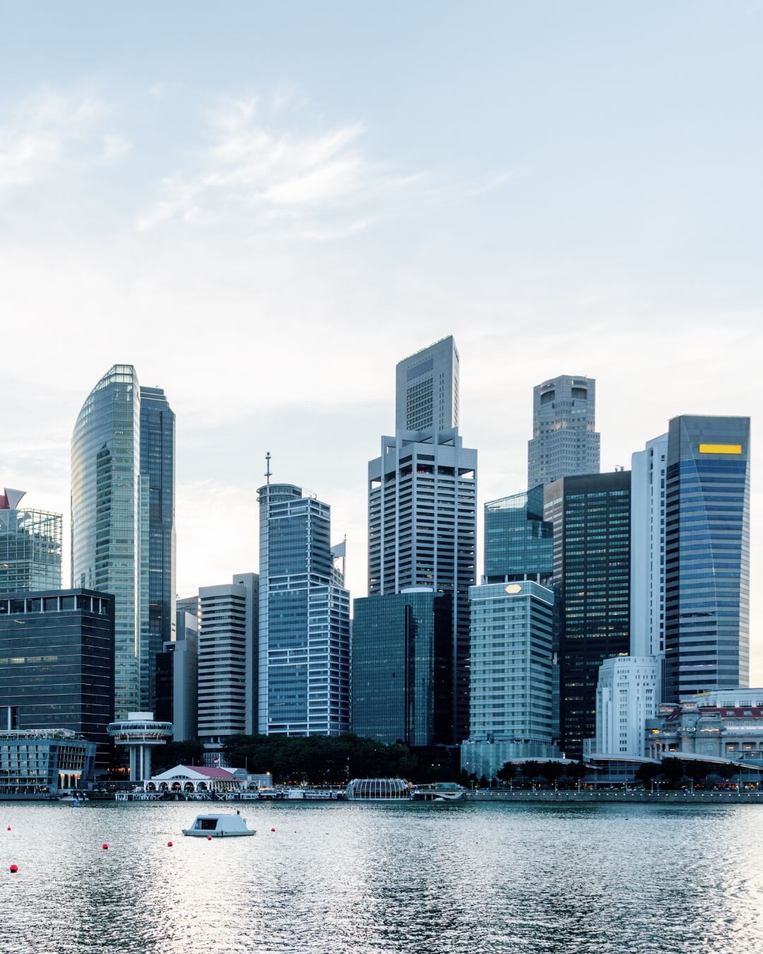 Skyline of a Southeast Asian financial district at dusk